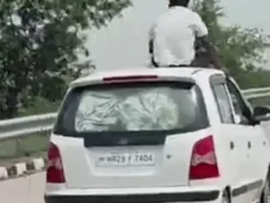 फरीदाबाद में चलती कार की छत पर बैठकर सफर, VIDEO वायरल: ट्रैफिक पुलिस ने ₹14 हजार का चालान काटा